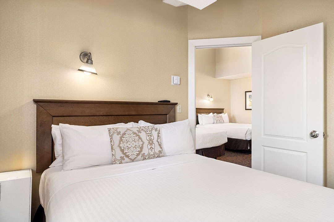 Superior two bedroom hotel room with 3 queen beds